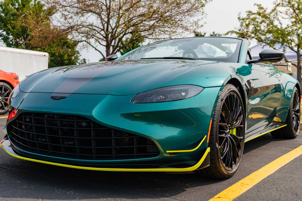 2024 Aston Martin V8 Vantage F1 Edition convertible, captured from a corner view, showcasing its sleek design and performance.