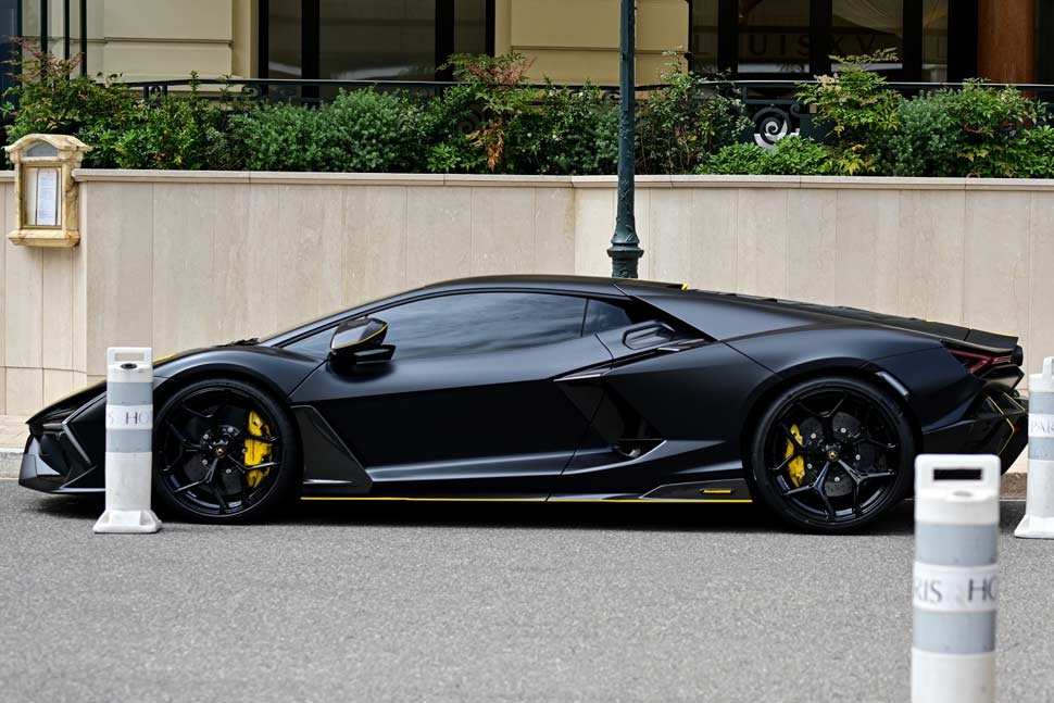 2024 Black Customized Lamborghini Revuelto, a sleek mid-engine plug-in hybrid sports car, showcasing luxury and performance.