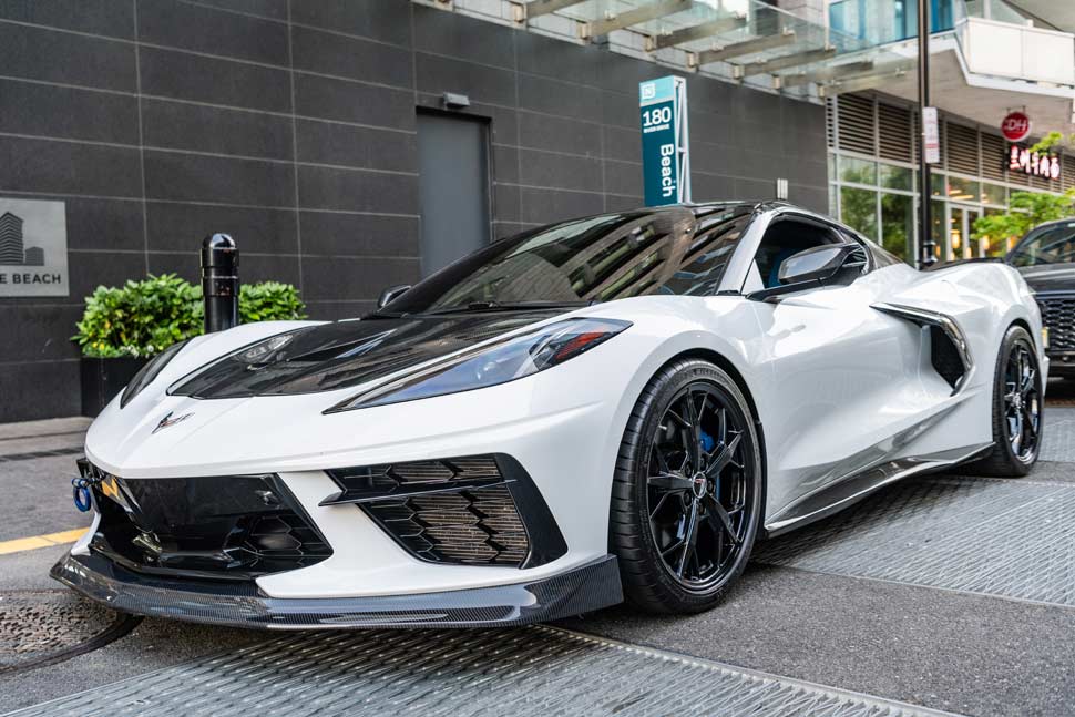 2025 Chevrolet Corvette Z06 luxury sports car parked outdoors, showcasing its sleek design and performance.