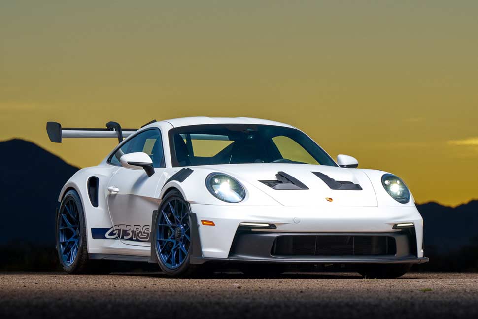 White 2025 Porsche 911 GT3 RS, a high-performance sports car, showcasing aerodynamic design and track-ready features.