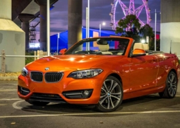 BMW 220i convertible photographed at sunset, a potential find when buying at an online auto auction.
