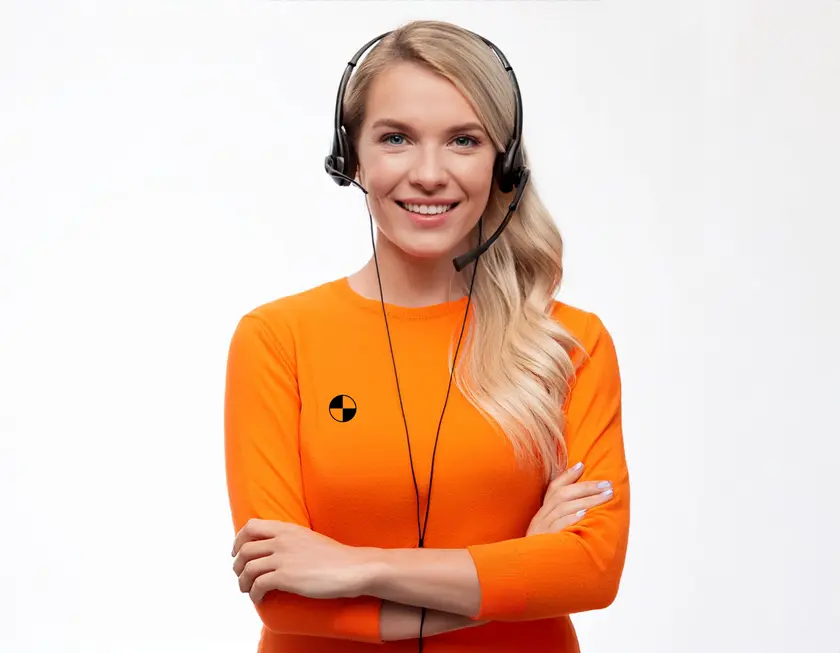 Friendly blonde female RideSafely customer service agent wearing an orange uniform and a headset, isolated on a white background.