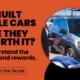 Buyer reviewing vehicle history reports while comparing rebuilt title and clean-title vehicles