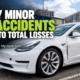 White Tesla Model 3 with minor side collision damage, illustrating why electric vehicles can be declared a total loss.