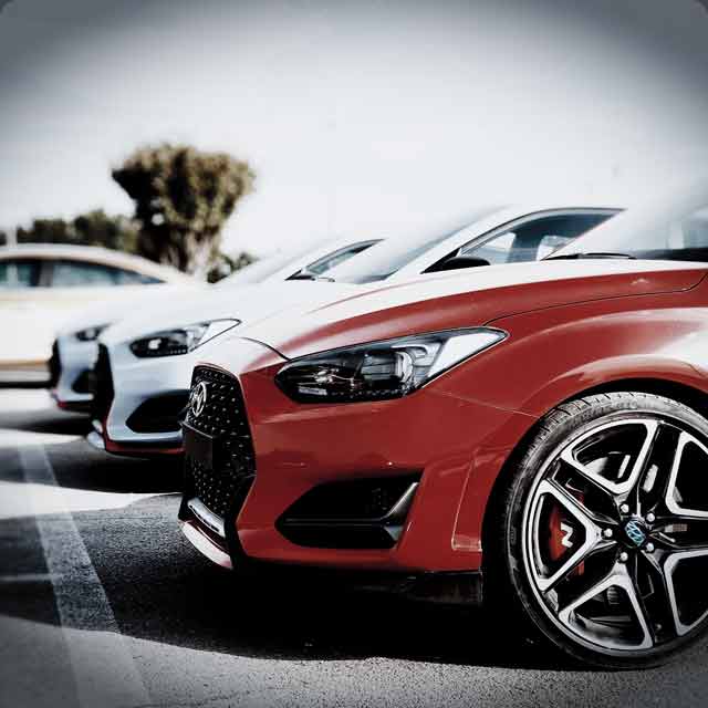 Red Hyundai sports car at an auto auction